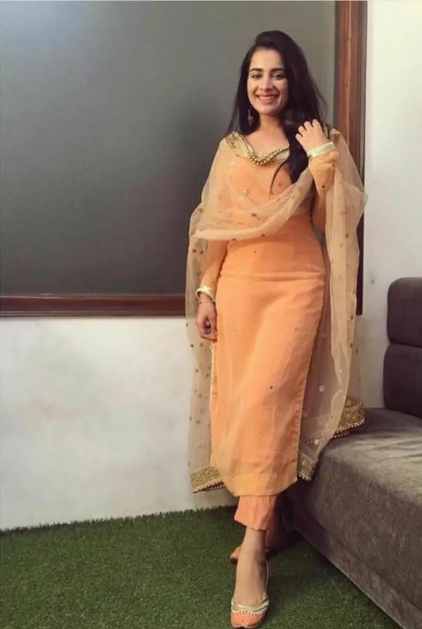 Light orange salwar suit with heavy dupatta